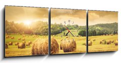 Obraz s hodinami   Field of freshly bales of hay with beautiful sunset, 150 x 50 cm