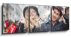 Obraz s hodinami   a trendy young couple wearing hats walking in the city in autum, 150 x 50 cm