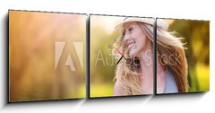 Obraz s hodinami 3D tdln - 150 x 50 cm F_BM76895615 - Beautiful woman outside in a park.