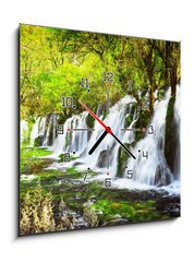 Obraz s hodinami 1D - 50 x 50 cm F_F107722539 - Scenic waterfall with crystal clear water among green forest - Scénický vodopád s křišťálově čistou vodou mezi zelenými lesy