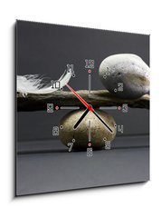Obraz s hodinami 1D - 50 x 50 cm F_F14789784 - feather and stone balance - pov a kamenn rovnovha