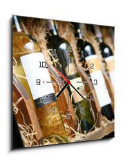 Obraz s hodinami 1D - 50 x 50 cm F_F20727251 - Closeup shot of wineshelf. Bottles lay over straw. - Detailní záběr z vinárny. Láhve ležely přes slámu.