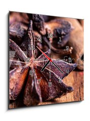 Obraz s hodinami 1D - 50 x 50 cm F_F222904649 - close up of star anise on wooden plank, slective focus