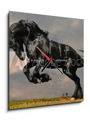Obraz s hodinami 1D - 50 x 50 cm F_F22600957 - black friesian stallion gallop in sunset - černý fríský hřebec cval v západu slunce