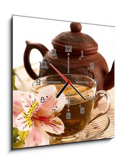 Obraz s hodinami   Cup of green tea on the table with orchid flower, 50 x 50 cm