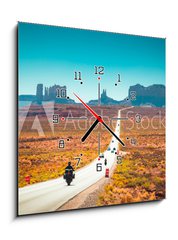 Obraz s hodinami 1D - 50 x 50 cm F_F244433077 - Biker on Monument Valley road at sunset, USA