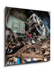 Obraz s hodinami 1D - 50 x 50 cm F_F265635496 - old car on the lift at auto repair shop