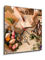 Obraz s hodinami 1D - 50 x 50 cm F_F266667837 - Florist writing in notebook at table