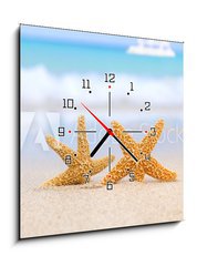 Obraz s hodinami 1D - 50 x 50 cm F_F28897412 - two starfish on beach, blue sea and white boat - dvě hvězdice na pláži, modré moře a bílé čluny