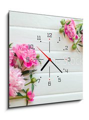 Obraz s hodinami 1D - 50 x 50 cm F_F313371368 - Pink peony flowers on white wooden table. womans day or wedding background. Top view. - Květy růžové pivoňky na bílém dřevěném stole. Zenske den nebo svatební pozadí. Pohled shora.