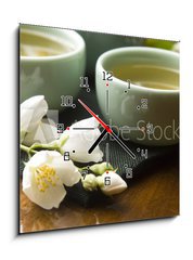 Obraz s hodinami 1D - 50 x 50 cm F_F42047983 - Green tea with jasmine in cup and teapot on wooden table