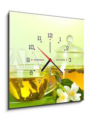 Obraz s hodinami   tea with jasmine in cup and teapot on table on green background, 50 x 50 cm