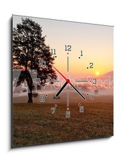 Obraz s hodinami 1D - 50 x 50 cm F_F50398429 - Alone tree on meadow at sunset with sun and mist - panorama