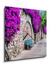 Obraz s hodinami 1D - 50 x 50 cm F_F50635038 - Vibrant flower draped pathway in Capri, Italy