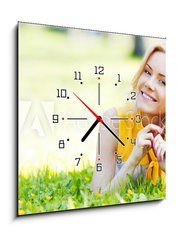 Obraz s hodinami 1D - 50 x 50 cm F_F61490597 - Woman on grass - Žena na trávě
