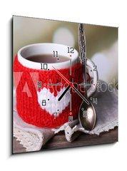 Obraz s hodinami 1D - 50 x 50 cm F_F71618914 - Cup of tasty hot tea, on wooden table, on light background