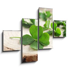 Obraz 4D tydln - 120 x 90 cm F_IB110661857 - Green clover leaves on a piece of wood, closeup