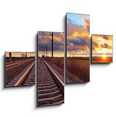 Obraz 4D tydln - 120 x 90 cm F_IB81148616 - Orange sunset in low clouds over railroad