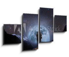 Obraz 4D tydln - 100 x 60 cm F_IS205708981 - a man with backpack standing on mountain peak at night, and silhouette mountain with bright full moon and sky full of stars